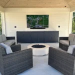 New, finished outdoor patio with comfortable seating, electricity, and entertainment system