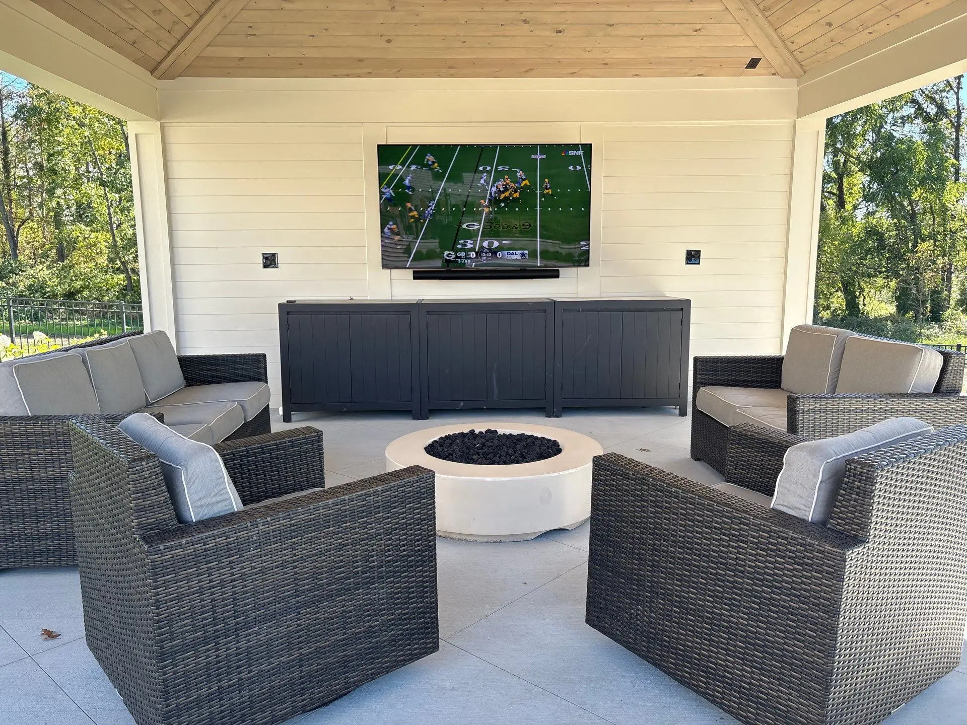 New, finished outdoor patio with comfortable seating, electricity, and entertainment system